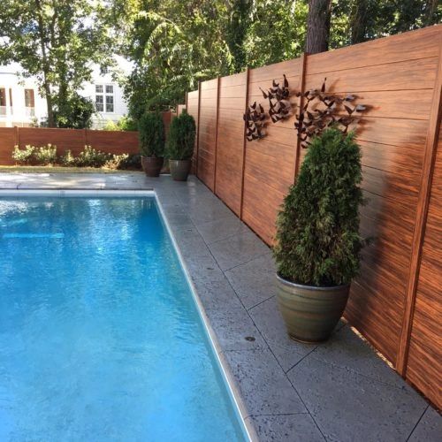 Residential backyard pool wood fence